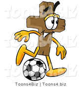 Illustration of a Cartoon Christian Cross Mascot Kicking a Soccer Ball by Mascot Junction