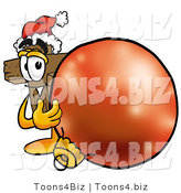 Illustration of a Cartoon Christian Cross Mascot Wearing a Santa Hat, Standing with a Christmas Bauble by Mascot Junction