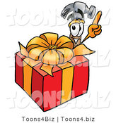 Illustration of a Cartoon Hammer Mascot Standing by a Christmas Present by Mascot Junction