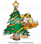 Illustration of a Cartoon Hard Hat Mascot Waving and Standing by a Decorated Christmas Tree by Mascot Junction