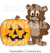 Vector Illustration of a Cartoon Bear Mascot by a Halloween Pumpkin by Mascot Junction