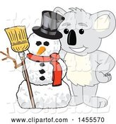 Vector Illustration of a Cartoon Koala Bear Mascot with a Christmas Winter Snowman by Mascot Junction