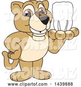 Vector Illustration of a Cartoon Lion Cub School Mascot Holding a Tooth by Mascot Junction