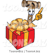 Vector Illustration of a Cartoon Mallet Mascot Standing by a Christmas Present by Mascot Junction