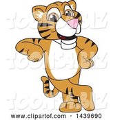 Vector Illustration of a Cartoon Tiger Cub Mascot Leaning by Mascot Junction