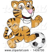 Vector Illustration of a Cartoon Tiger Cub Mascot Playing Soccer by Mascot Junction