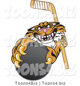 Vector Illustration of a Cartoon Tiger Mascot Grabbing a Hockey Puck by Mascot Junction