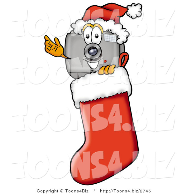 Illustration of a Cartoon Camera Mascot Wearing a Santa Hat Inside a Red Christmas Stocking