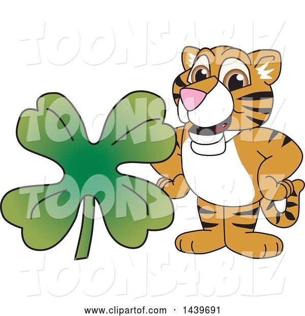 Vector Illustration of a Cartoon Tiger Cub Mascot with a St Patricks Day Clover