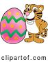 Vector Illustration of a Cartoon Tiger Cub Mascot with an Easter Egg by Mascot Junction