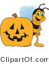 Vector Illustration of a Worker Bee Mascot by a Halloween Pumpkin by Mascot Junction