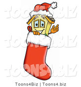 Illustration of a Cartoon House Mascot Wearing a Santa Hat Inside a Red Christmas Stocking by Mascot Junction