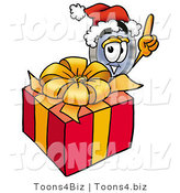 Illustration of a Cartoon Magnifying Glass Mascot Standing by a Christmas Present by Toons4Biz