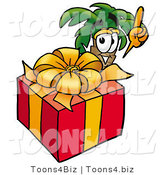 Illustration of a Cartoon Palm Tree Mascot Standing by a Christmas Present by Mascot Junction