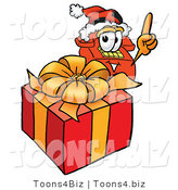 Illustration of a Red Cartoon Telephone Mascot Standing by a Christmas Present by Toons4Biz