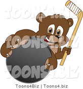 Vector Illustration of a Cartoon Bear Mascot Grabbing a Hockey Puck by Mascot Junction