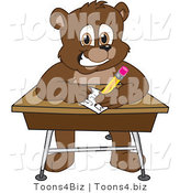 Vector Illustration of a Cartoon Bear Mascot Writing on a Desk by Mascot Junction