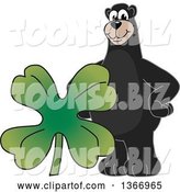 Vector Illustration of a Cartoon Black Bear School Mascot with a Four Leaf St Patricks Day Clover by Mascot Junction