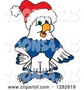Vector Illustration of a Cartoon Christmas Seahawk Mascot Wearing a Santa Hat by Toons4Biz