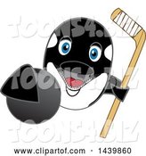 Vector Illustration of a Cartoon Killer Whale Orca Mascot Grabbing a Hockey Puck and Holding a Stick by Mascot Junction