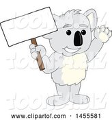 Vector Illustration of a Cartoon Koala Bear Mascot Holding a Blank Sign by Mascot Junction
