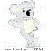 Vector Illustration of a Cartoon Koala Bear Mascot Leaning by Toons4Biz