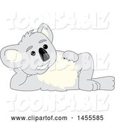 Vector Illustration of a Cartoon Koala Bear Mascot Resting on His Side by Toons4Biz