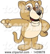 Vector Illustration of a Cartoon Lion Cub School Mascot Pointing by Mascot Junction
