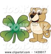 Vector Illustration of a Cartoon Lion Cub School Mascot with a St Patricks Day Clover by Mascot Junction