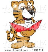 Vector Illustration of a Cartoon Tiger Cub Mascot Reading a Book by Mascot Junction