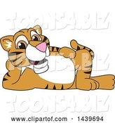 Vector Illustration of a Cartoon Tiger Cub Mascot Relaxing by Mascot Junction