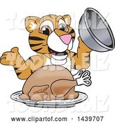 Vector Illustration of a Cartoon Tiger Cub Mascot Serving a Thanksgiving Turkey by Mascot Junction