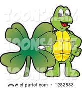 Vector Illustration of a Cartoon Turtle Mascot with a St Patricks Day Four Leaf Clover Shamrock by Mascot Junction