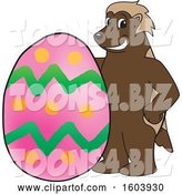 Vector Illustration of a Cartoon Wolverine Mascot with an Easter Egg by Mascot Junction