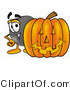 Illustration of a Cartoon Hockey Puck Mascot with a Carved Halloween Pumpkin by Mascot Junction
