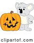 Vector Illustration of a Cartoon Koala Bear Mascot with a Halloween Jackolantern Pumpkin by Toons4Biz