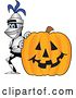 Vector Illustration of a Cartoon Lancer Mascot Smiling by a Halloween Jackolantern Pumpkin by Mascot Junction