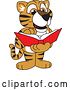 Vector Illustration of a Cartoon Tiger Cub Mascot Reading a Book by Mascot Junction