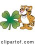 Vector Illustration of a Cartoon Tiger Cub Mascot with a St Patricks Day Clover by Mascot Junction